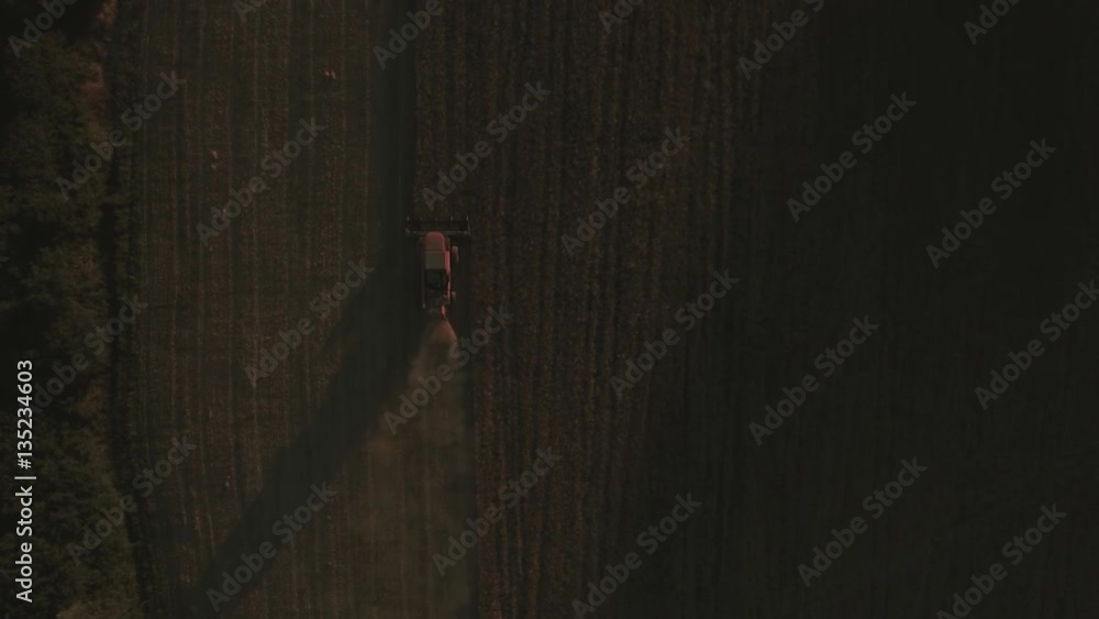 Directly above shot of tractor harvesting in crop field
Directly above shot of tractor harvesting in crop field