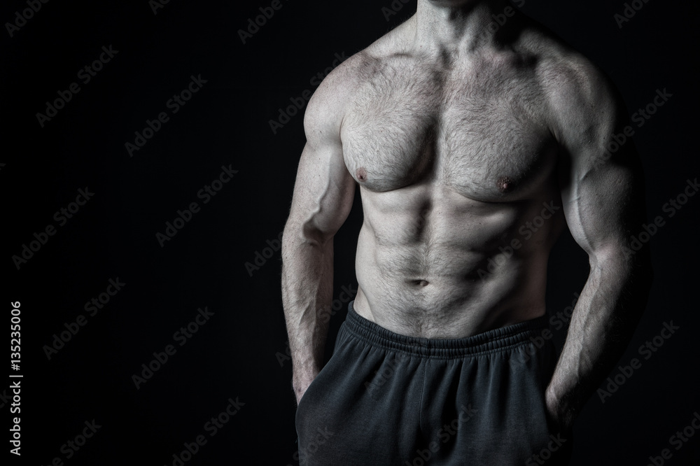 sexy muscular male torso with hairy chest of man workout