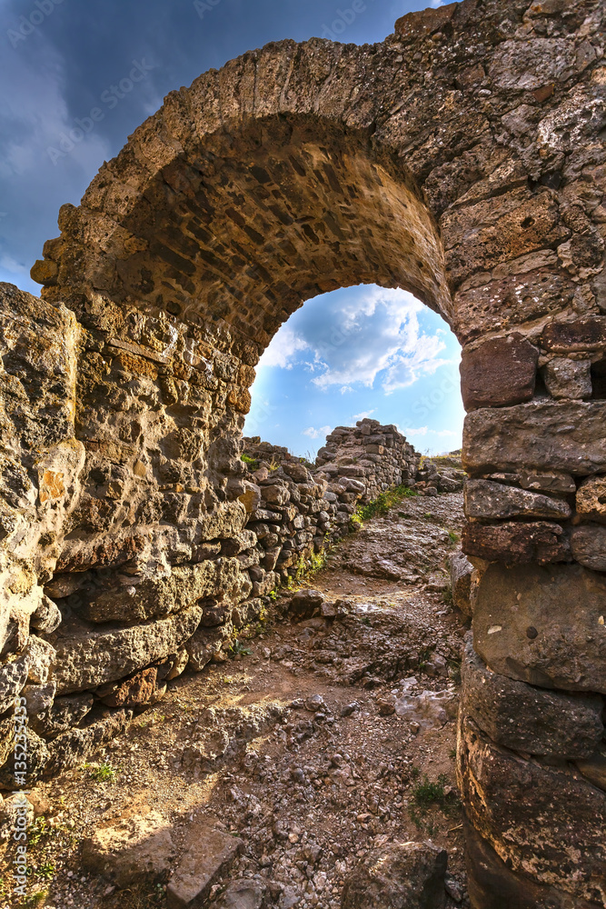  ruins, under a sky stone arch
