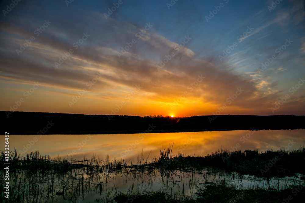 Spring dawn on the river Don is reflecting in calm water Spring dawn on the river Don is reflecting in calm water
