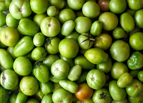Many green tomatoes top view