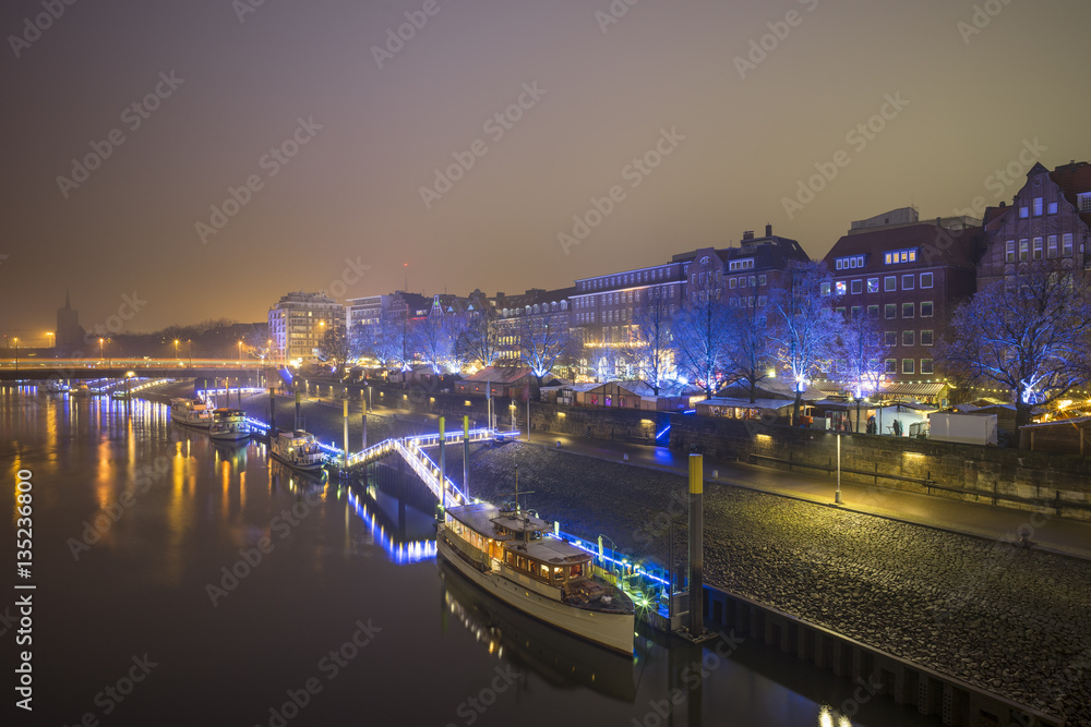 Night view of Weser river in Bremen, Germany.