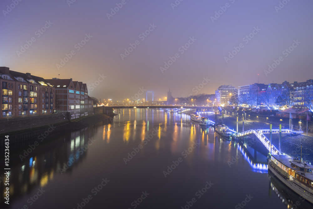 Night view of Weser river in Bremen, Germany.