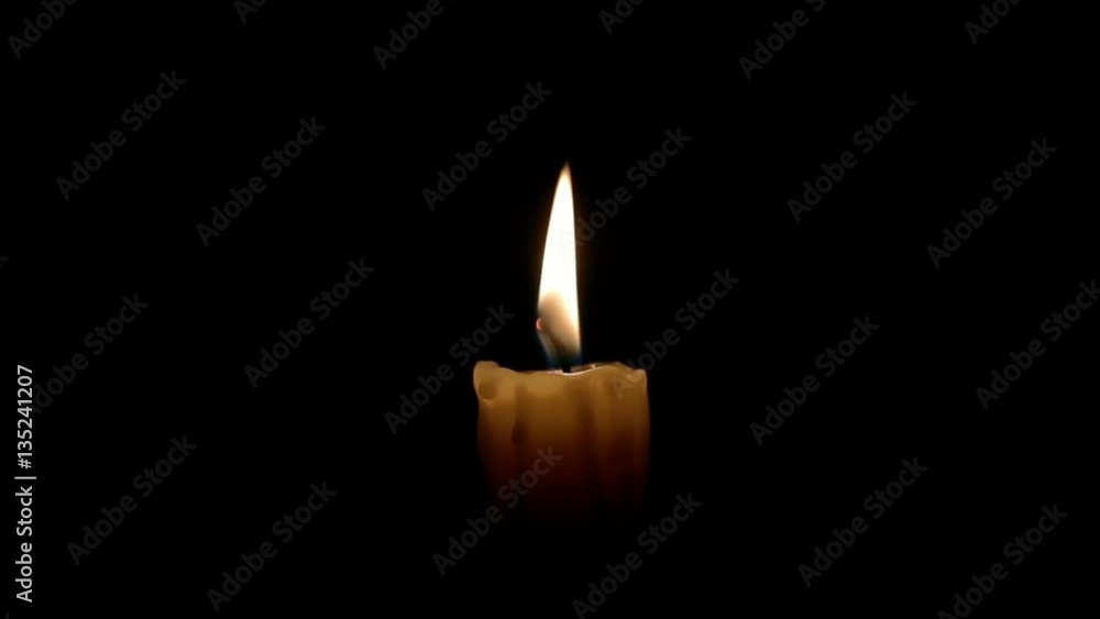 Closeup of one candle on black backgrounds. Closeup of one candle on black backgrounds.