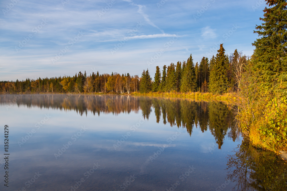 Kelly Lake, small lake which provide habitat for fish, birds, beavers and river otters with a small semi remote campsite. Alaska, USA. Kelly Lake, small lake which provide habitat for fish, birds, beavers and river otters with a small semi remote campsite. Alaska, USA.