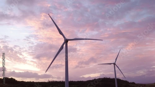 Windmills truning in the wind at Sunset in Hawaii 03