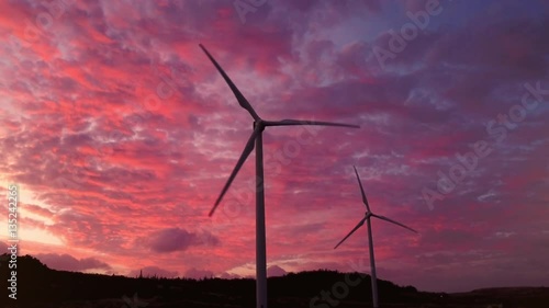 Windmills truning in the wind at Sunset in Hawaii 02