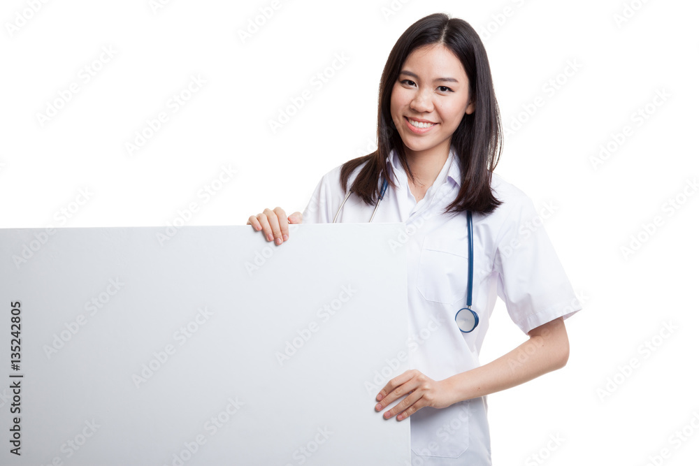Young Asian female doctor hold a blank sign. Young Asian female doctor hold a blank sign.