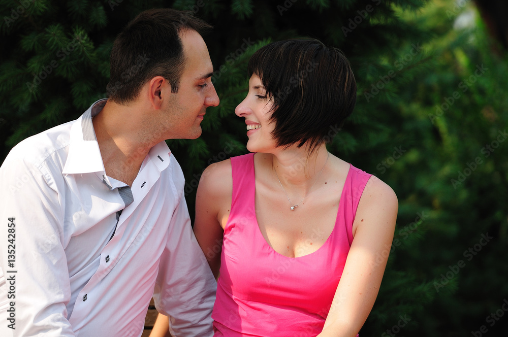 happy couple sitting outdoors happy couple sitting outdoors