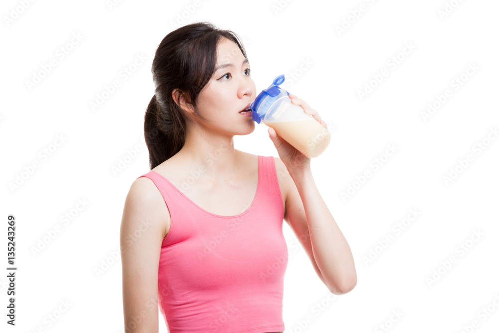 Beautiful Asian healthy girl drinking whey protein. Beautiful Asian healthy girl drinking whey protein.