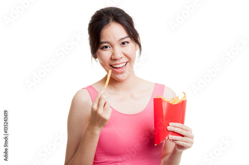 Beautiful Asian healthy girl eat  french fries.