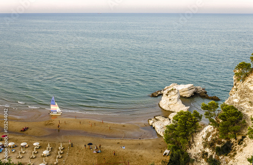 Costa mediterranea balneabile con spiaggia e scogli photo