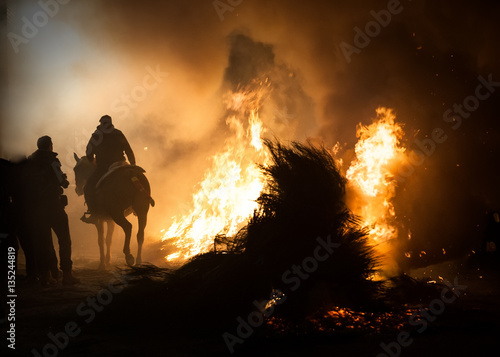 Horses jumping above the fire without fear © David San Segundo