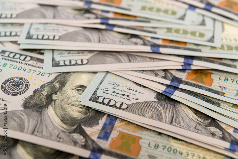 Heap of cash in hundred dollar bills Heap of cash in hundred dollar bills