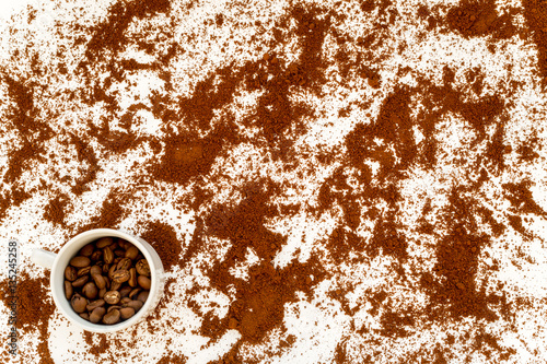 coffee beans on gray with coffe cup table top view