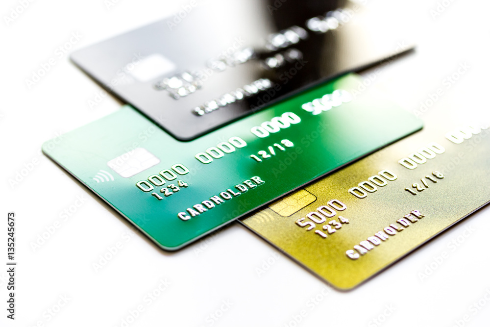 pile of credit cards on white background pile of credit cards on white background