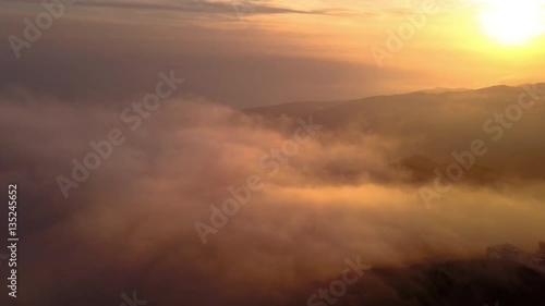 Aerial Drift in Golden Fog Covering Malibu Mountains at Sunset
