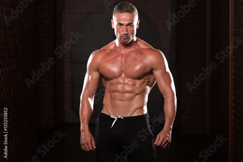 Young Man Showing Abdominal Muscle
