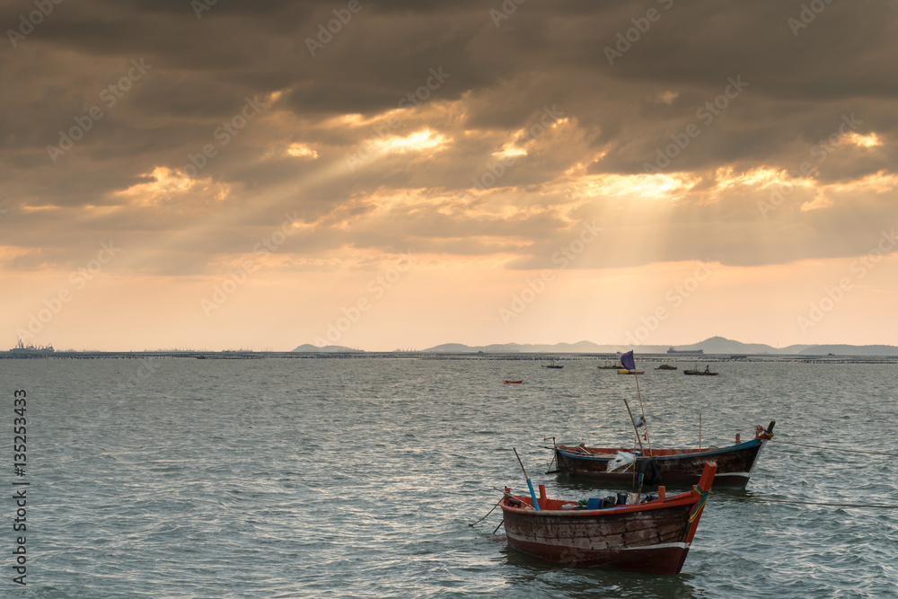 Silhouette of Small Ships in The Sea at Twilight Time