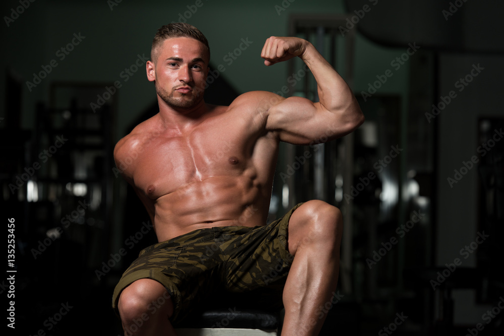 Young Bodybuilder Flexing Muscles
