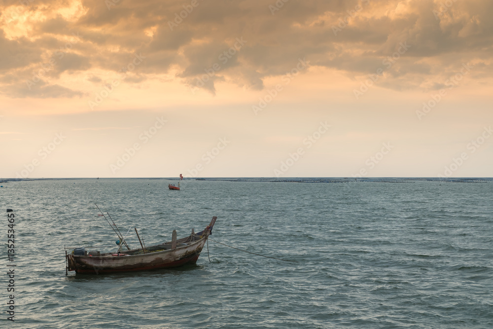 Silhouette of Small Ships in The Sea at Twilight Time