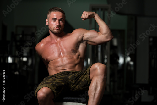 Young Bodybuilder Flexing Muscles