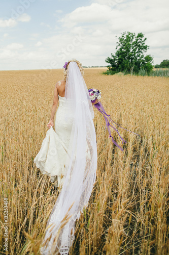 Bride Walking In A Wheat Field
