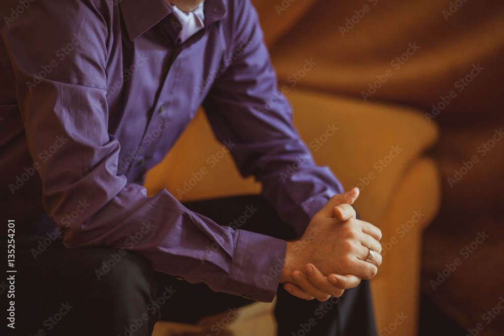 groom's hands with wedding ring