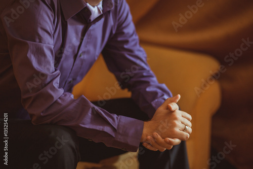 groom's hands with wedding ring
