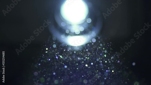 The bright projector illumination with dust particle stream. Macro close up view