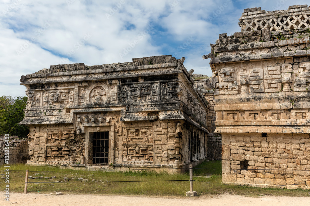 Naklejka premium Ancient Mayan Terminal Classic governmental palace, constructed in the Puuc architectural style decorated with elaborate masks in Chichen Itza, Yucatan, Mexico.