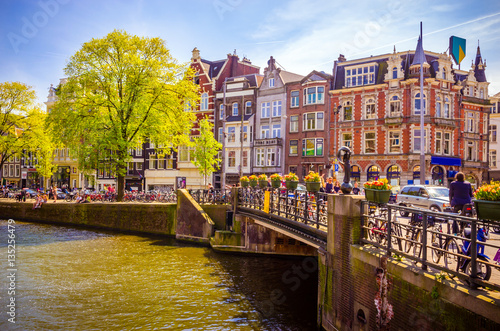 Photography Traditional old buildings and and boats in Amsterdam, Netherland