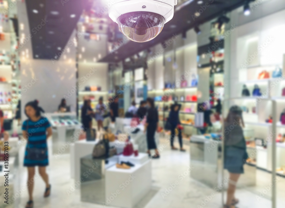 CCTV security camera on shopping department store.