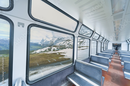 Interior of passenger train with empty seats © leeyiutung