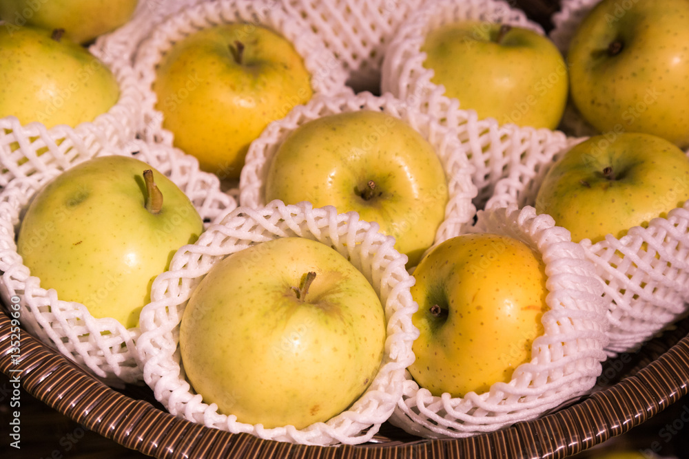 Heap of organic juicy apple with protective foam mesh Heap of organic juicy apple with protective foam mesh
