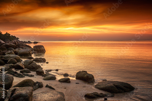 A beautiful rocky beach at sunset