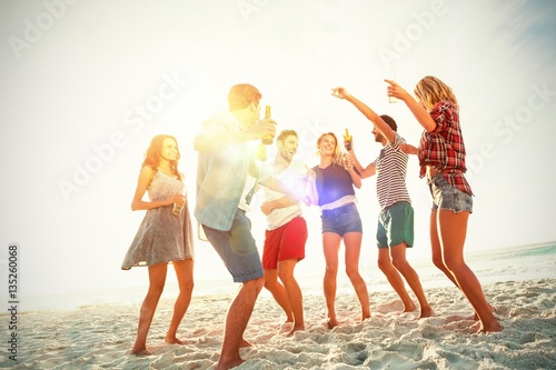 Friends dancing at beach