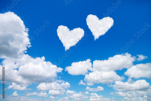 Canvas Print couple white heart shaped clouds on blue sky