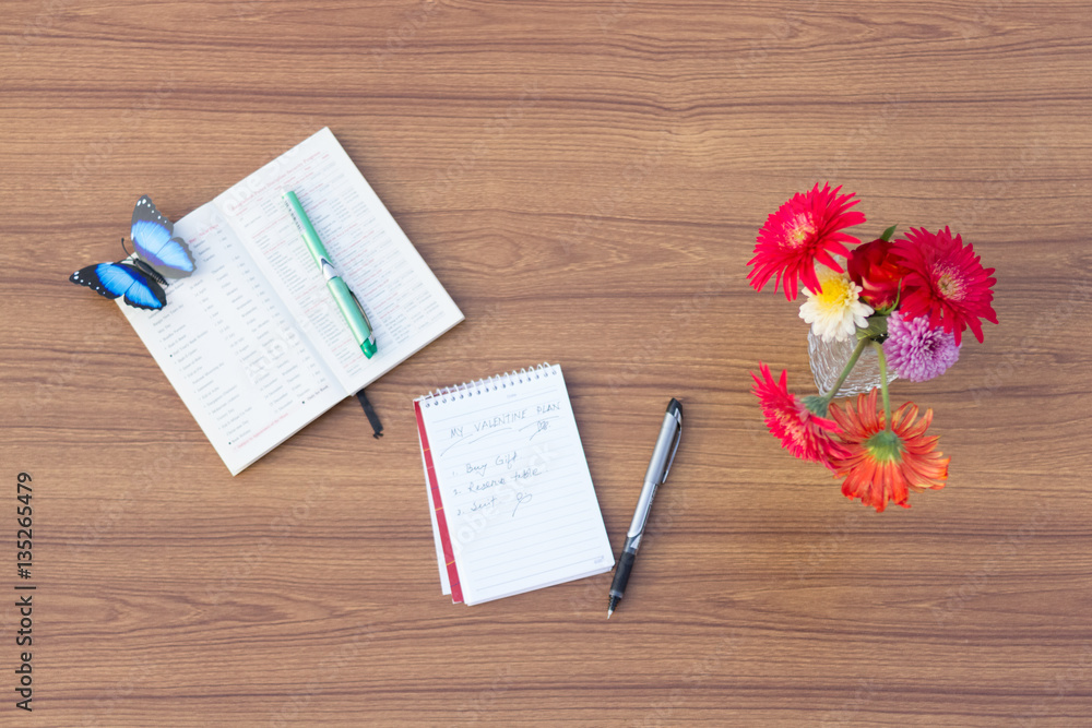 Corporate Office, Office Table Top, Note Book and Flowers on the Wooden Background Corporate Office, Office Table Top, Note Book and Flowers on the Wooden Background