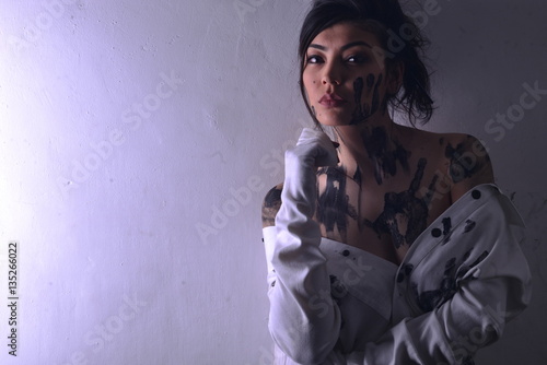 Portrait of young sexy model as a victim with dirty skin