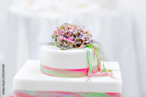 Wedding cake in white, green and rose  photo