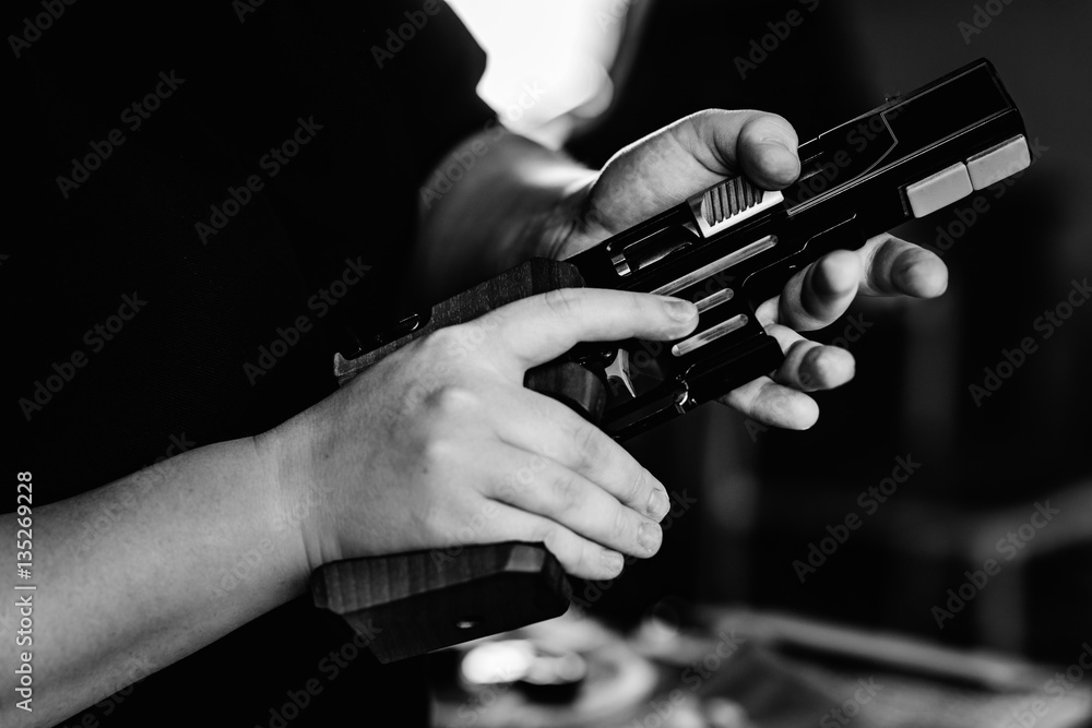 Woman pulling pistol on sport shooting training Woman pulling pistol on sport shooting training