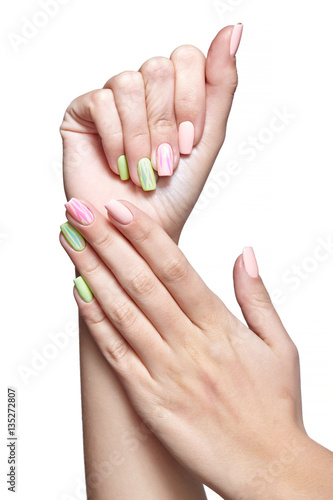 Female hands with woman s professional natursl pink and green na