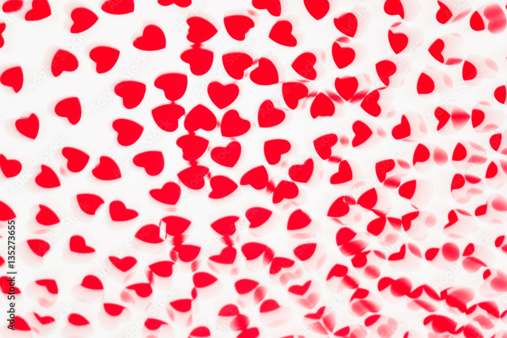 Valentine's day decorative soft blur abstract pattern of red hearts confetti on white background. Festive valentine backdrop. Valentine's day decorative soft blur abstract pattern of red hearts confetti on white background. Festive valentine backdrop.