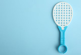 Toy racket  on a blue background.