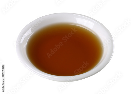 Fish sauce in white bowl isolated on background