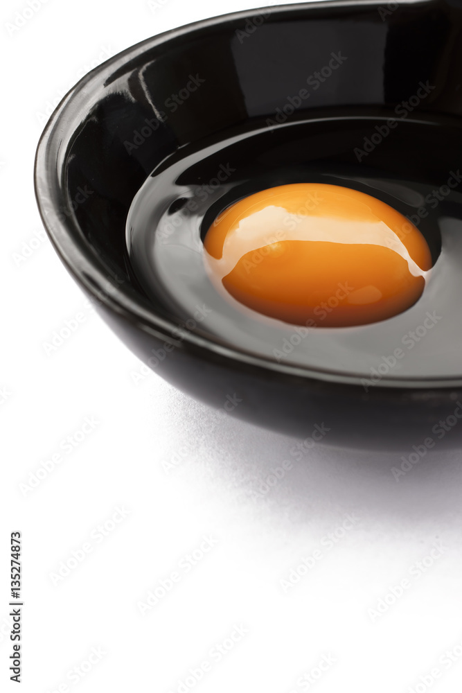 Eggs cooking for breakfast, a protein form yolk and albumen on a white background, or on a plain wooden table. Eggs cooking for breakfast, a protein form yolk and albumen on a white background, or on a plain wooden table.