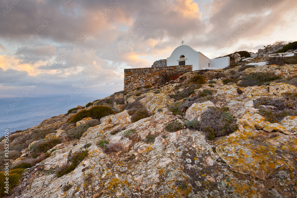Church over village of Kastro on Sikinos island early in the morning.