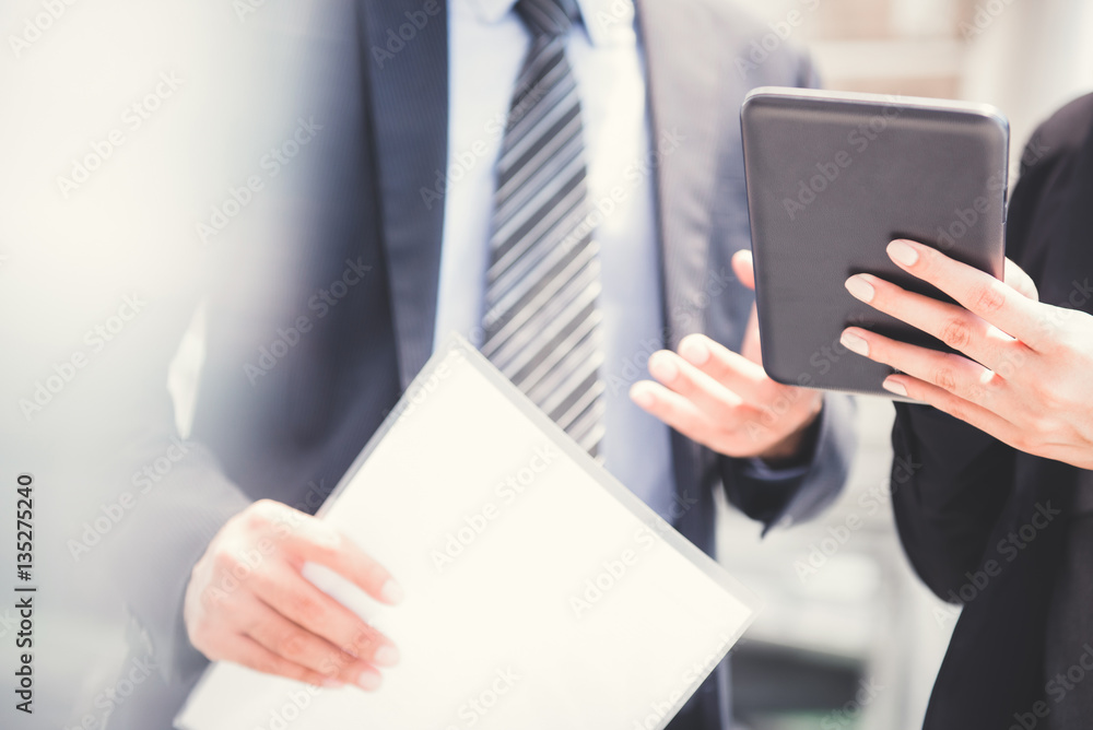 Businessman and businesswoman using tablet pc Businessman and businesswoman using tablet pc