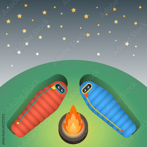The character is in a sleeping bag sleeping on green grass on a starry sky in the camp near the fire